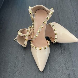 Nude pumps Valentino similarity.